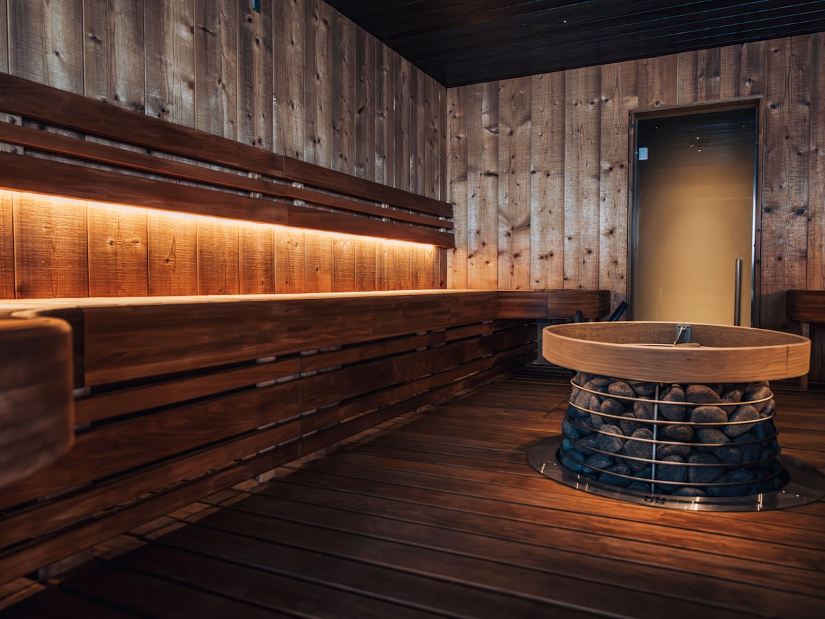 Warm timber sauna interior with bench seating